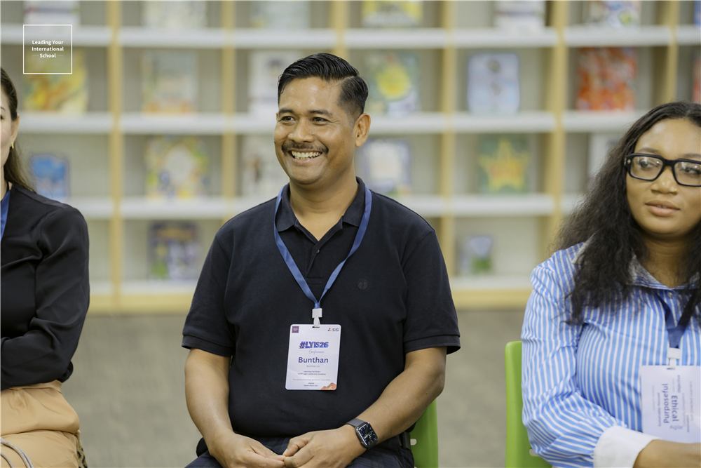 Delegates listening in a library session
