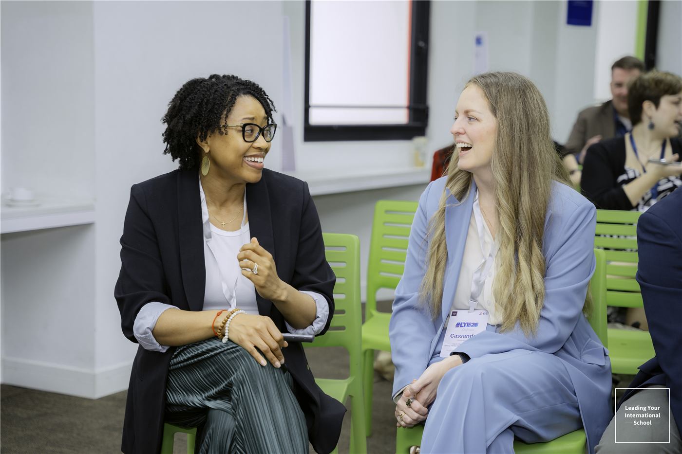 Two leaders in conversation at an LYIS event