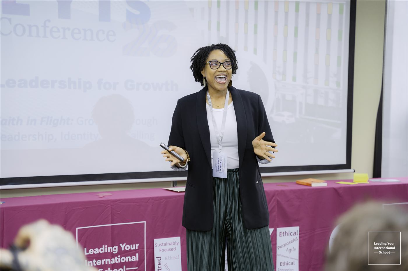 A speaker presenting at the #LYIS26 conference